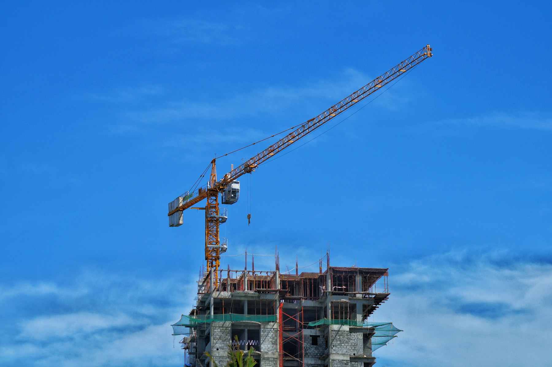 Tower crane over a high-rise building under construction